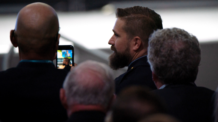 President Donald Trump acknowledges Chicago police Officer Adam Wazny, right, during his speech at the International Association of Chiefs of Police conference at McCormick Place on Oct. 28, 2019. Wazny was shot while serving an arrest warrant.