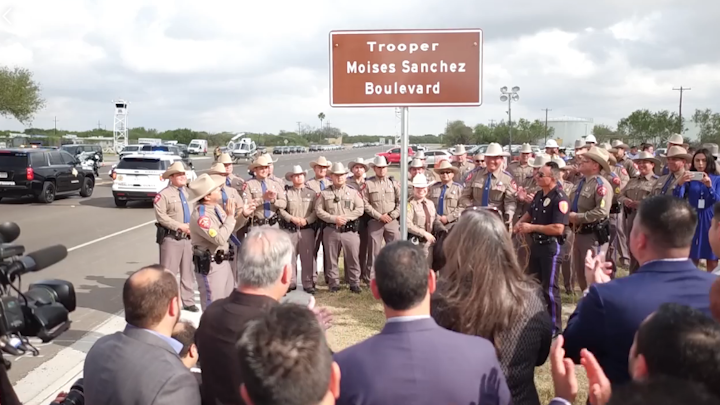 At the corner of N. 10th Street and State Highway 107, Edinburg police joined state troopers, Border Patrol and other brothers in blue in unveiling a new street, Trooper Moises Sanchez Boulevard.