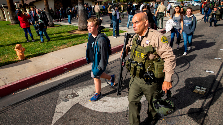 Students are evacuated from Saugus High School where a gunman opened fire in Santa Clarita, Calif., on Nov. 14, 2019.