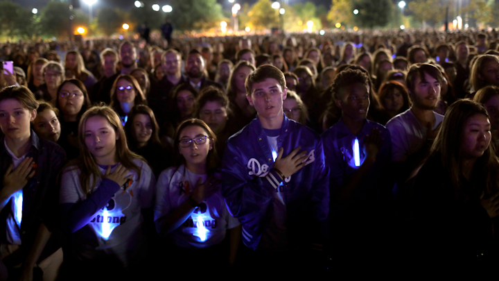 Students say the Pledge of Allegience as thousands gather at Central Park in Santa Clarita to remember those killed (two plus the shooter) and wounded in the Saugus High School shooting on Nov. 17 2019.