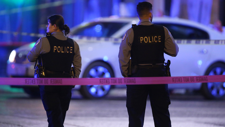 Police work the scene at North Lowell Ave and West Irving Park Road, where a Chicago police officer was shot and wounded in a gun battle near the Kennedy Expressway on Nov. 19, 2019.