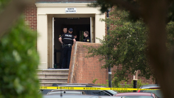 Police work the scene where eleven people were killed and six injured during a mass shooting at the Virginia Beach city public works building on May 31, 2019.