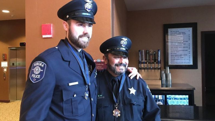 Aurora Police Officer Adam Miller returned to the midnight shift Tuesday for the first time since he was shot in the face on Feb. 15 and Officer Reynaldo Rivera, who was shot twice in the leg, also returned to full duty last week on the day shift.