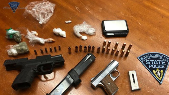 Instead of getting a tank of gas, two men found themselves in handcuffs after state police said they were caught with drugs and guns.