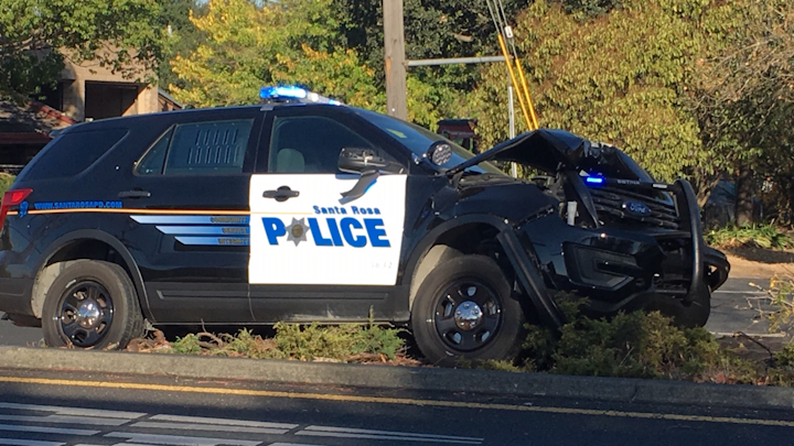 A Santa Rosa police officer was injured early Tuesday in a city crash involving a suspected hit-and-run driver.