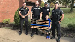 A Montgomery County Police Department precinct was told on Friday by an official to remove a 'Thin Blue Line' flag given to them by a local woodworker on National First Responders Day.