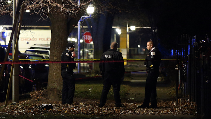 Chicago police guard a crime scene in the 5700 block of S. May Street in Chicago after several people were shot there on Sunday, Dec. 22, 2019.