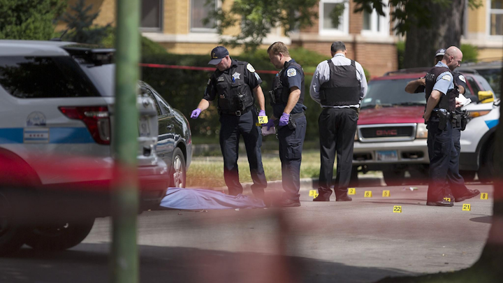 Chicago police investigate the shooting death of Cedron Doles in the 8100 block of South Paulina Street on July 10, 2017, in the Auburn Gresham neighborhood.