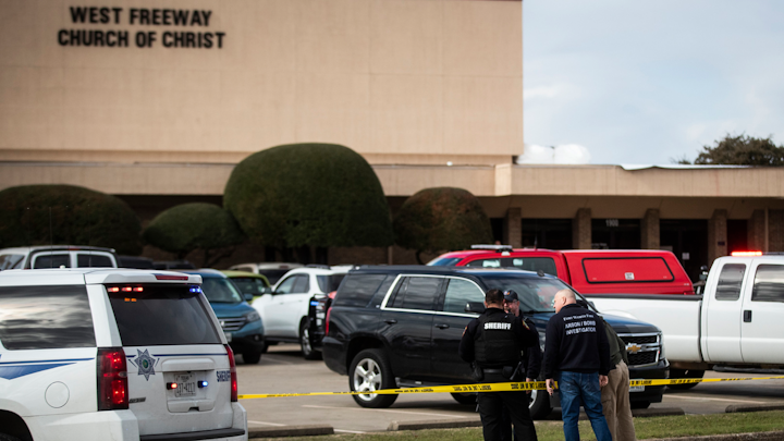 Police and fire department officials surround a scene of a shooting Sunday, Dec. 29, 2019, at West Freeway Church of Christ in White Settlement, Texas.