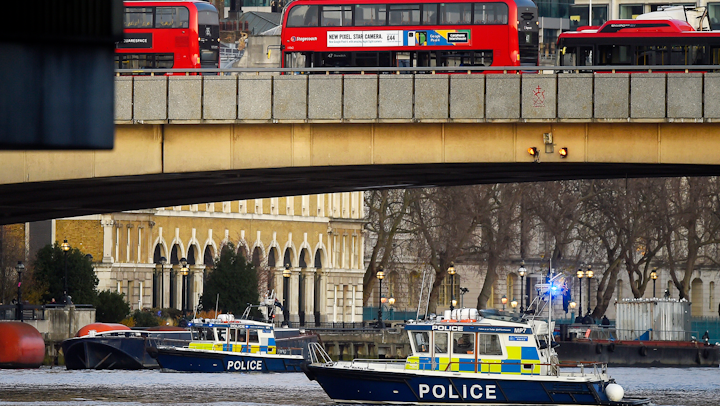 Boats from the Metropolitan Police Marine Policing Unit patrol near the scene of a stabbing attack on London Bridge on Friday, Nov. 30.