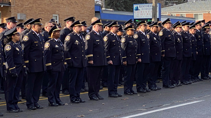 Hundreds of police officers from across the country were joined by civilians Friday at Rasheen McClain's funeral at Greater Grace Temple in Detroit.
