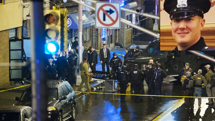 Jersey City Police Detective Joseph Seals, a father of five, was pronounced dead at about 12:45 p.m. Tuesday, after the officer, dressed in plainclothes, approached one of the suspects, reportedly in connection with a homicide investigation.