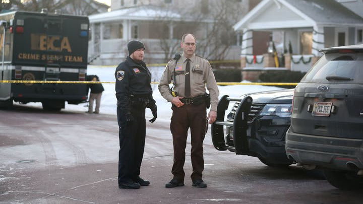 Law enforcement officers were at the scene Tuesday morning in Waseca, Minn., after a police officer and a suspect were shot Monday night following reports of a disturbance in a residential neighborhood.