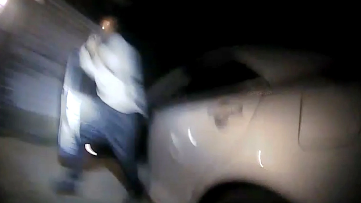 Videos released by the Texas Department of Public Safety on Tuesday show that a 27-year-old man shot by two troopers after a traffic stop last summer was holding a gun.