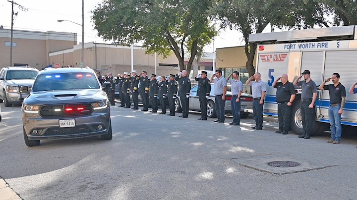 Lubbock Police Officer Nicholas Reyna and Fire Rescue Lt. Eric Hill were escorted to Fort Worth Sunday morning as hundreds of residents, officers, firefighters and other first responders lined up to honor the fallen heroes.