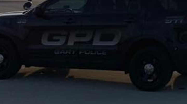 A suspect was killed and two Gary officers were wounded during a shootout Monday as a police SWAT team attempted to execute a warrant.