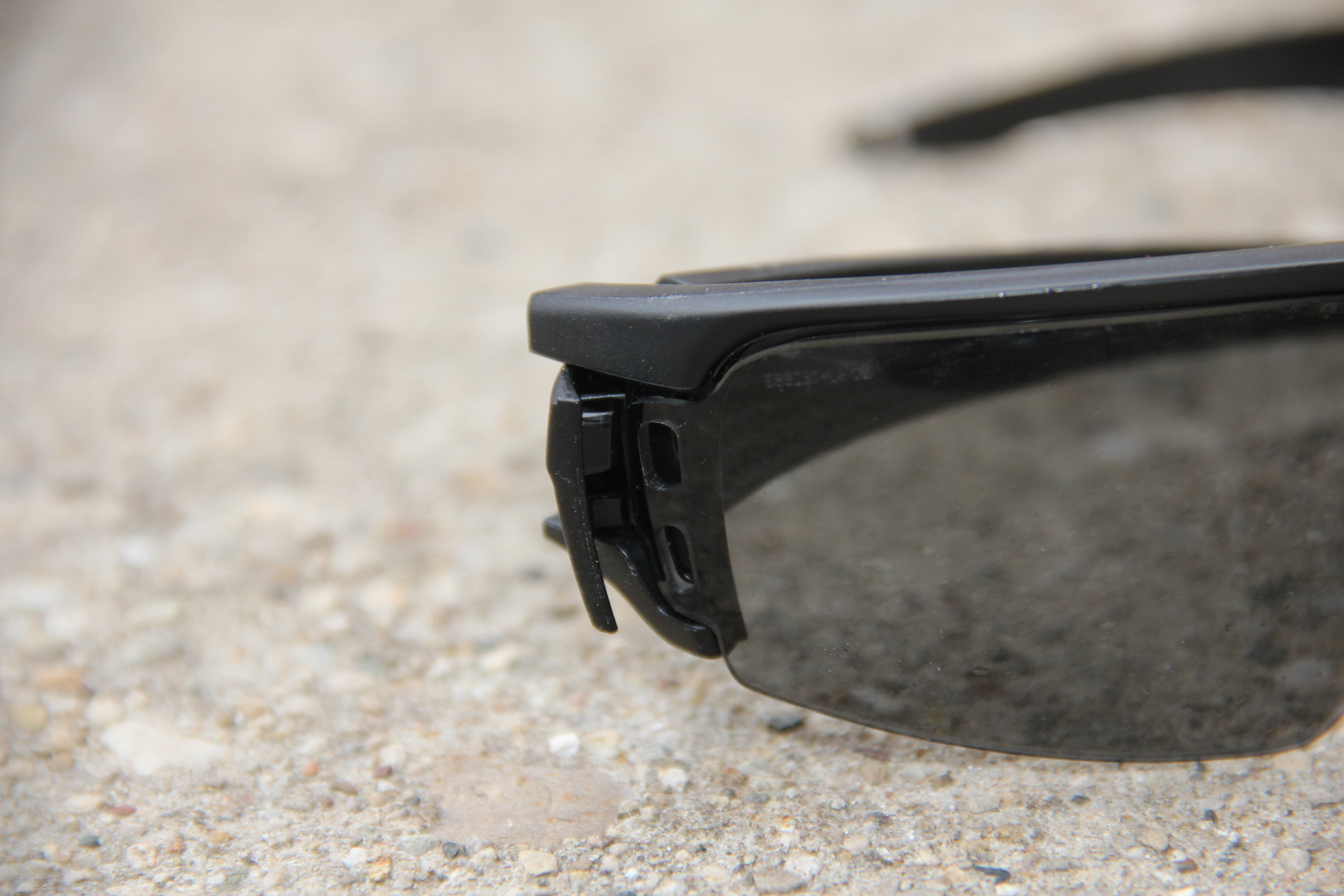 Look closely at the left edge of the lens. You can see two holes to set your lenses in. The frame has one guiding point on the bottom, the Lens Gate has the other - securely holding the frame in place.