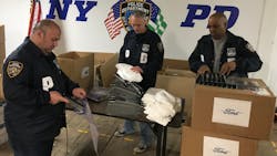 NYPD officers sort through the 1,500 plastic face shields that were donated by the Ford Motor Company to aid officers on the front lines in the fight against the coronavirus. NYPD officers sort through the 1,500 plastic face shields that were donated by the Ford Motor Company to aid officers on the front lines in the fight against the coronavirus.