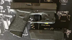 The Glock 43 with standard magazine inserted and Streamlight TLR-6 mounted. Magazine with +2 floorplate for backup shown.