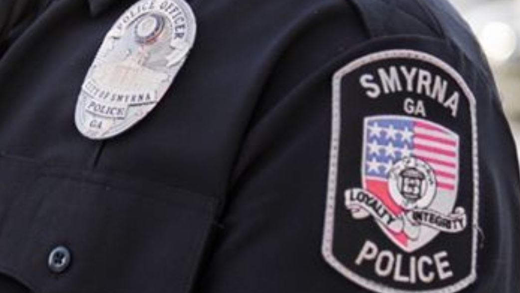 A Smyrna police officer was killed in a collision with another vehicle while on duty Monday night.