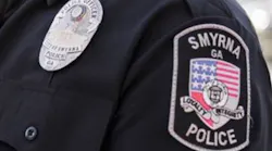 A Smyrna police officer was killed in a collision with another vehicle while on duty Monday night.