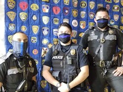Officers from New Mexico State Police and the Ruidoso (NM) Police Department wear masks made and donated by local citizens.