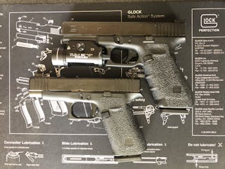 Glock 48 (bottom) compared to a Glock 17 (4th gen - top). Much slimmer, shorter carry package.