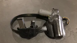 The classic 1911 .45ACP, spare magazine and a good quality flashlight - a very typical CCW rig.