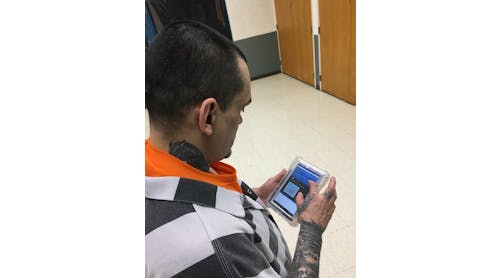 Anthony Woodman using a Securus Technologies SecureView&circledR; Tablet.