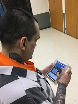 Anthony Woodman using a Securus Technologies SecureView&circledR; Tablet.