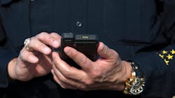 Officer using FirstNet on smartphone device Officer using FirstNet on smartphone device