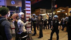 Protesters and police stand off outside a McDonald's at North Wells Street and West North Avenue in Chicago on May 31, 2020. Protesters and police stand off outside a McDonald's at North Wells Street and West North Avenue in Chicago on May 31, 2020.