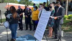 Activist Connie Burton addresses a news conference Wednesday at Tampa Park Apartments on new measures police will institute to help build community trust.