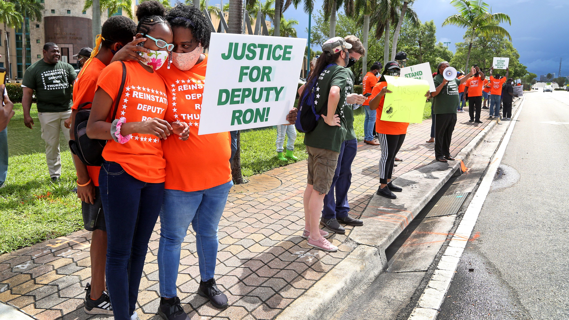 Ja'Liah Gammage, 11, and her mother, Kamika, of Pompano Beach participate in a protest to reinstate Broward Deputy Ron Thurston in front of BSO headquarters in Fort Lauderdale on Thursday June 4, 2020.