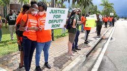 Ja'Liah Gammage, 11, and her mother, Kamika, of Pompano Beach participate in a protest to reinstate Broward Deputy Ron Thurston in front of BSO headquarters in Fort Lauderdale on Thursday June 4, 2020. Ja'Liah Gammage, 11, and her mother, Kamika, of Pompano Beach participate in a protest to reinstate Broward Deputy Ron Thurston in front of BSO headquarters in Fort Lauderdale on Thursday June 4, 2020.