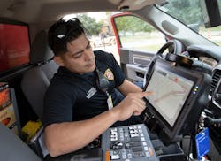 Firefighter and paramedic using FirstNet to receive geographic mapping data