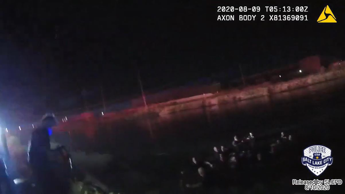 Newly released video shows Salt Lake City police officers and firefighters help save children from a submerged vehicle Saturday night.