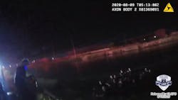 Newly released video shows Salt Lake City police officers and firefighters help save children from a submerged vehicle Saturday night.