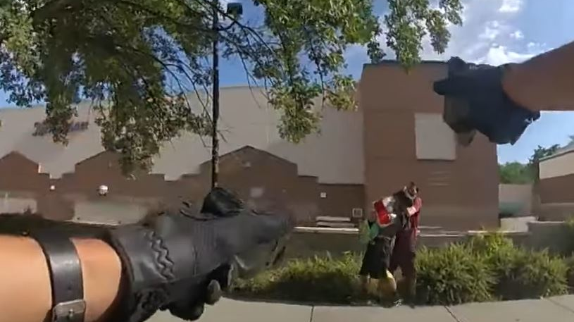 Body camera footage released on Friday shows Salt Lake City police officers fatally shoot a suspect holding a knife to another man's neck in late July.