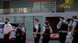 Chicago police officers gather outside the emergency area of Stroger Hospital after two Chicago police officers were wounded in a shooting during a traffic stop in the Homan Square neighborhood early Sunday, August 30, 2020, in Chicago. Chicago police officers gather outside the emergency area of Stroger Hospital after two Chicago police officers were wounded in a shooting during a traffic stop in the Homan Square neighborhood early Sunday, August 30, 2020, in Chicago.