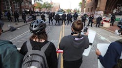 Protesters face off with Rochester police officers in front of City Hall on Wednesday. Protesters face off with Rochester police officers in front of City Hall on Wednesday.