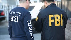 JCODE Task Force members confer during search warrant execution in Los Angeles in February 2020. JCODE Task Force members confer during search warrant execution in Los Angeles in February 2020.