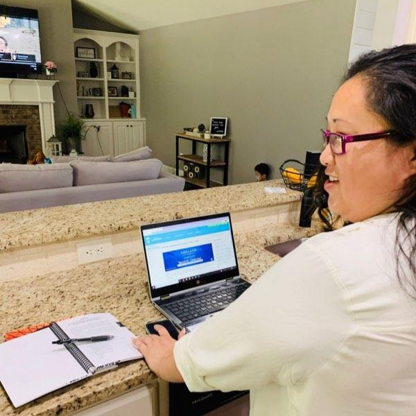 Former incarcerated individual Amy Yang working on her Lantern studies on her computer.