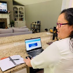 Former incarcerated individual Amy Yang working on her Lantern studies on her computer. Former incarcerated individual Amy Yang working on her Lantern studies on her computer.