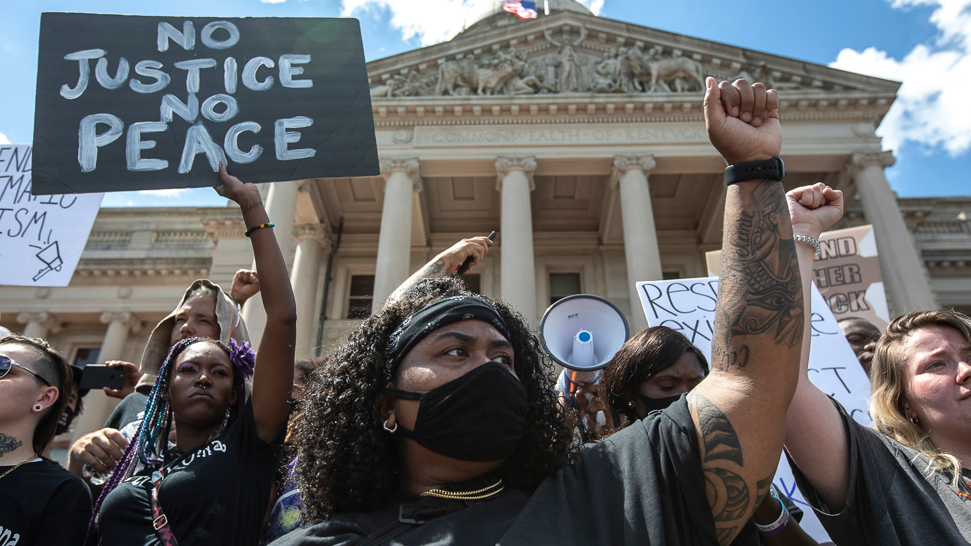 Hundreds of protesters gather during a rally Thursday, June 25, 2020 demanding justice for Breonna Taylor outside the Kentucky state Capitol in Frankfort, Kentucky.