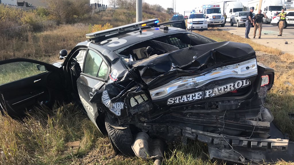 An Oklahoma State Patrol trooper was injured after his patrol car was struck on a highway Wednesday morning.