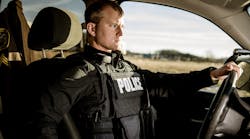 Properly fit body armor has to provide maximum coverage but also take into consideration the amount of time officers spend sitting in their patrol vehicle. Seen here is Hard Core PT overt/outer carrier from Armor Express.
