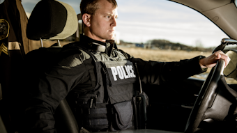 Properly fit body armor has to provide maximum coverage but also take into consideration the amount of time officers spend sitting in their patrol vehicle. Seen here is Hard Core PT overt/outer carrier from Armor Express.