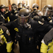 Riot police clear the hallway inside the Capitol on Wednesday, Jan. 6, 2021, in Washington, D.C.