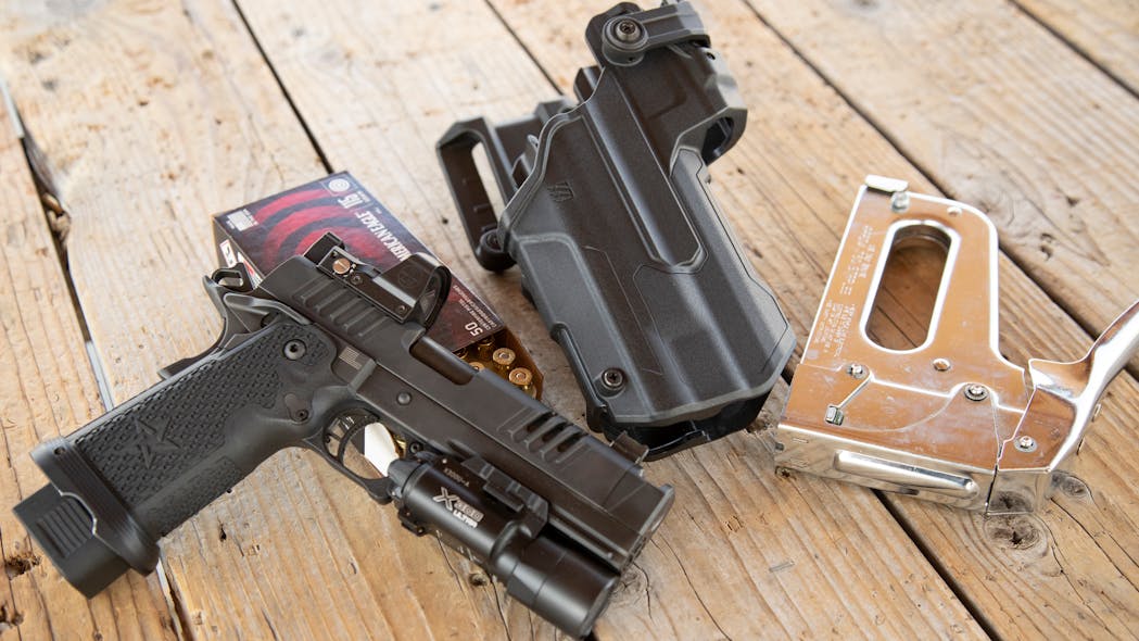 Since the T Series Holster is open on the bottom, it can handle some accessories like compensators and threaded barrels. Shown here is a Staccato XC, basically a Staccato P with an integrated compensator and a Leopold Delta Point Pro. Notice the extended 20 round magazine. This gives the Staccato P an awesome balance for quick shot strings.